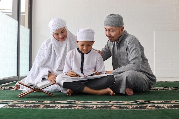 A family studying the Quran together.
